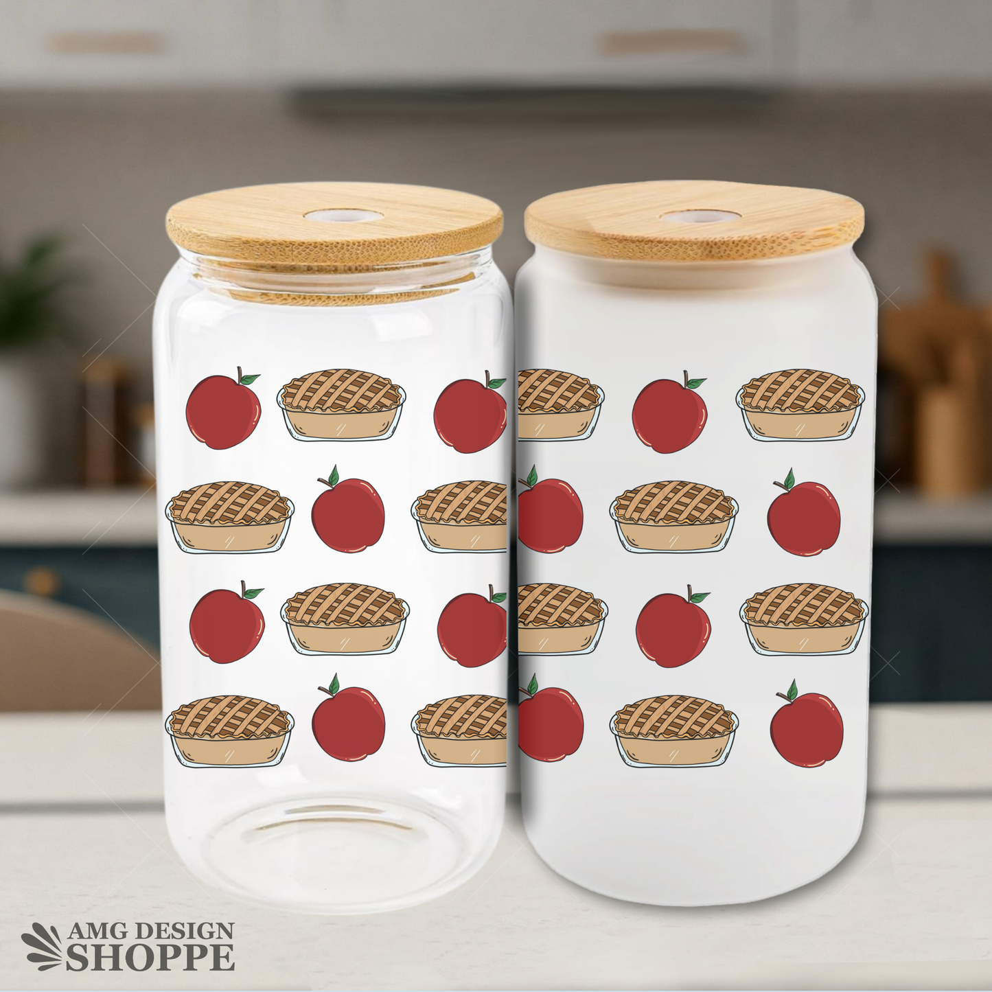 Two clear glass canisters with bamboo lids, decorated with a pattern of red apples and apple pies, shown on a kitchen countertop with a blurred kitchen background.