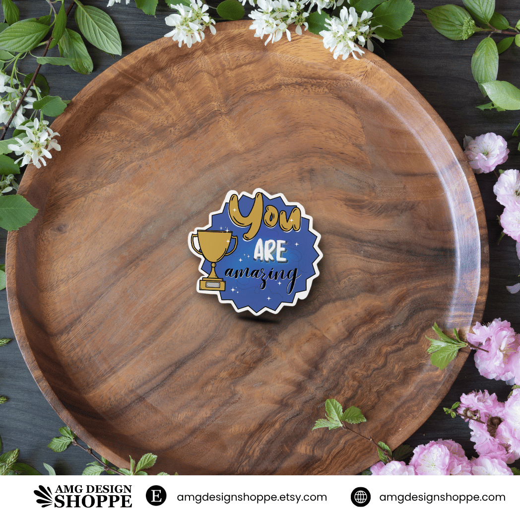 Sticker with 'You Are Amazing' with a gold trophy - Size 3"x3" and is made with waterproof vinyl and laminate